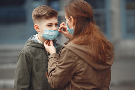 Boy And Mother Are Wearing Protective Masks